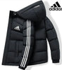 Black puffer jacket with Adidas logo and branding on a white background